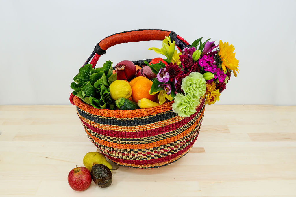 Bestselling handwoven market basket filled with fresh, colorful fruit, showcasing artisan craftsmanship and versatile use.