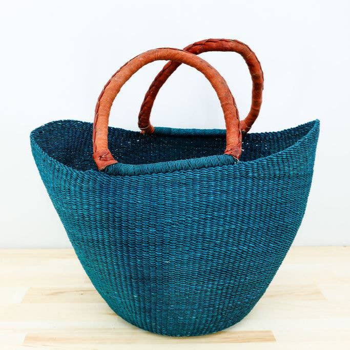 Solid color Ghanaian U-shopper basket with leather handle.
