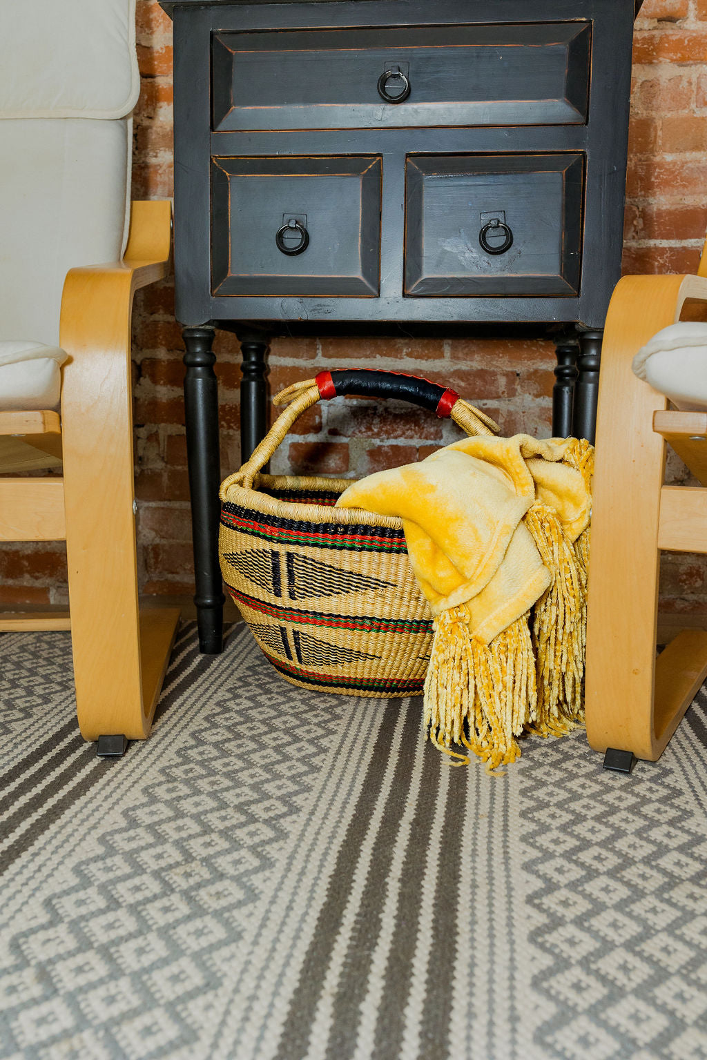 Bolga basket with cozy blanket in a home.