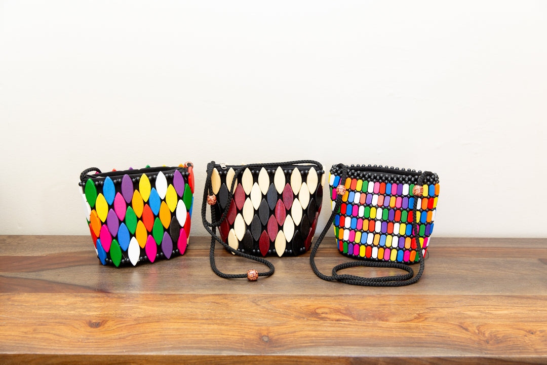 Vibrant new collection of handcrafted colorful handbags, made by artisans using sustainable materials and traditional techniques.