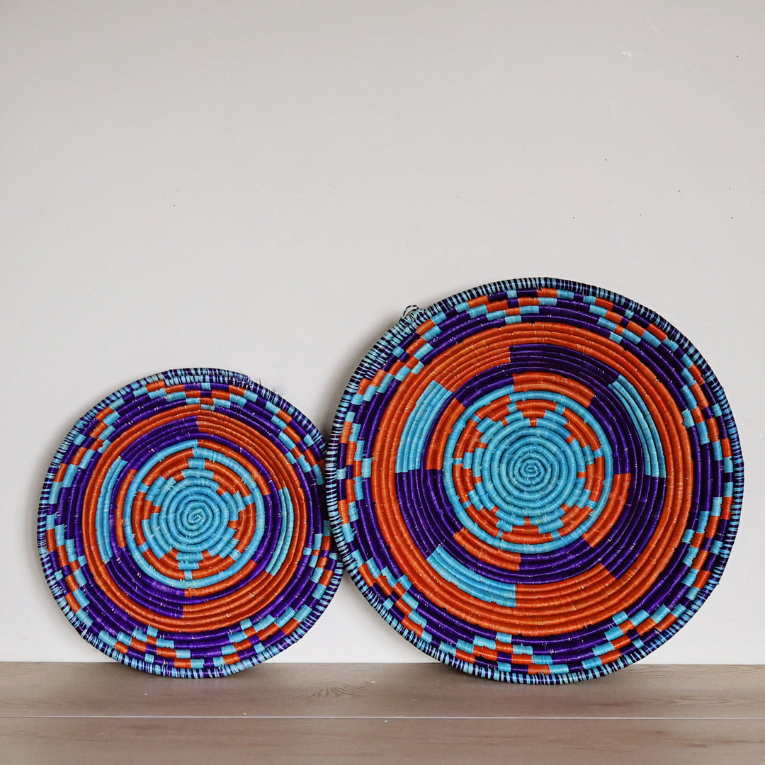 Shop fair trade Bukedo & Raffia Bowls handwoven in Uganda. Artisan wall baskets, decorative bowls, fruit bowls, and global home décor made from palm raffia.