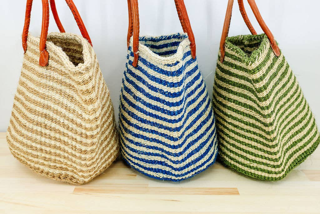 Eco-friendly striped sisal tote bag with leather straps, ideal for storage or errands.