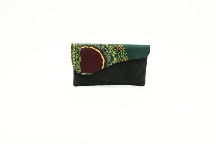 Fair trade clutch purse made from up-cycled upholstery and African wax print fabric, handmade by artisans.