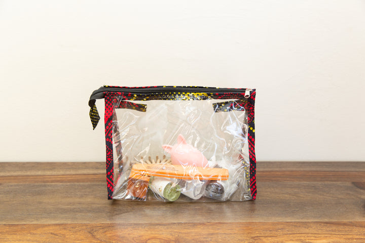 Unique fair trade zipper bag with vibrant up-cycled textiles, ethically made for conscious living.