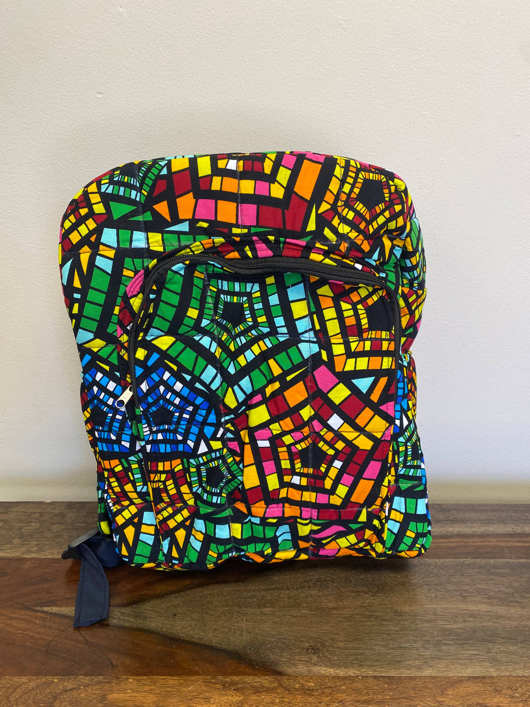 Sustainable patchwork backpack with colorful fabric scraps, crafted in Kenya, ideal for travel, everyday use, or ethical gifts.