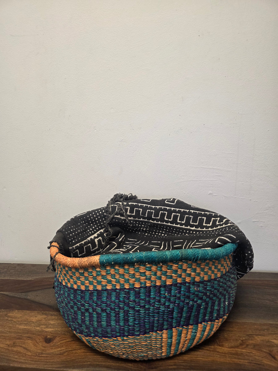 Fair trade African Market Basket with no handles handwoven from hand dyed Kinkanhe grass used for storage.