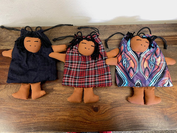 Fair trade doll bag featuring a stitched-in African doll wearing traditional dress, made in Kenya.

