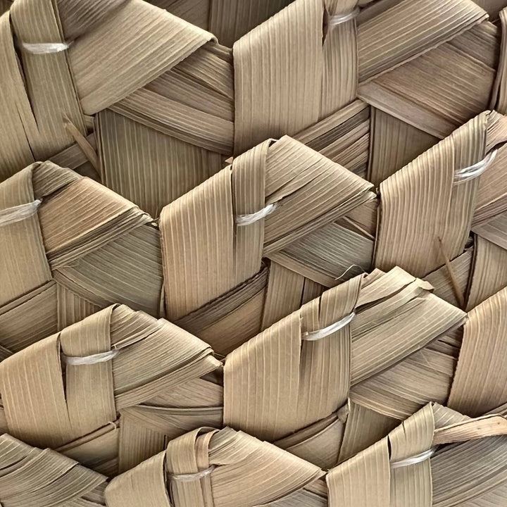 Lightweight banana leaf basket details that can be used as a centerpiece, key holder, or gallery wall accent.