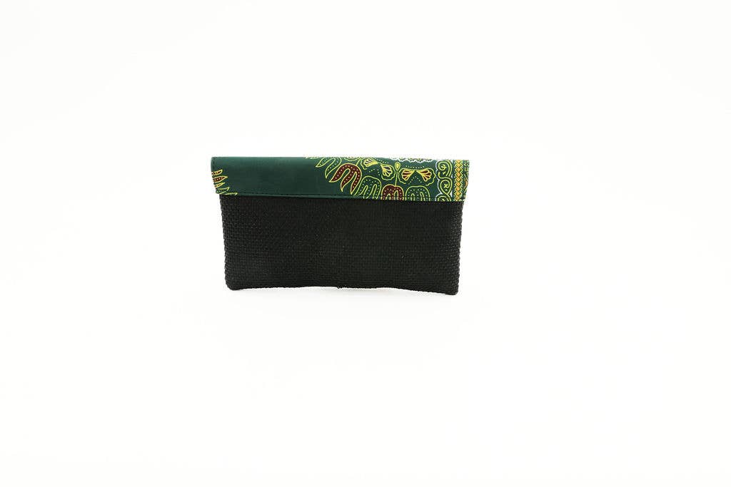 Eco-friendly fair trade purse featuring colorful African cloth and repurposed upholstery material.