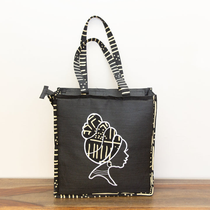 Ethically made laptop tote in multicolor prints, ideal for work or casual use.