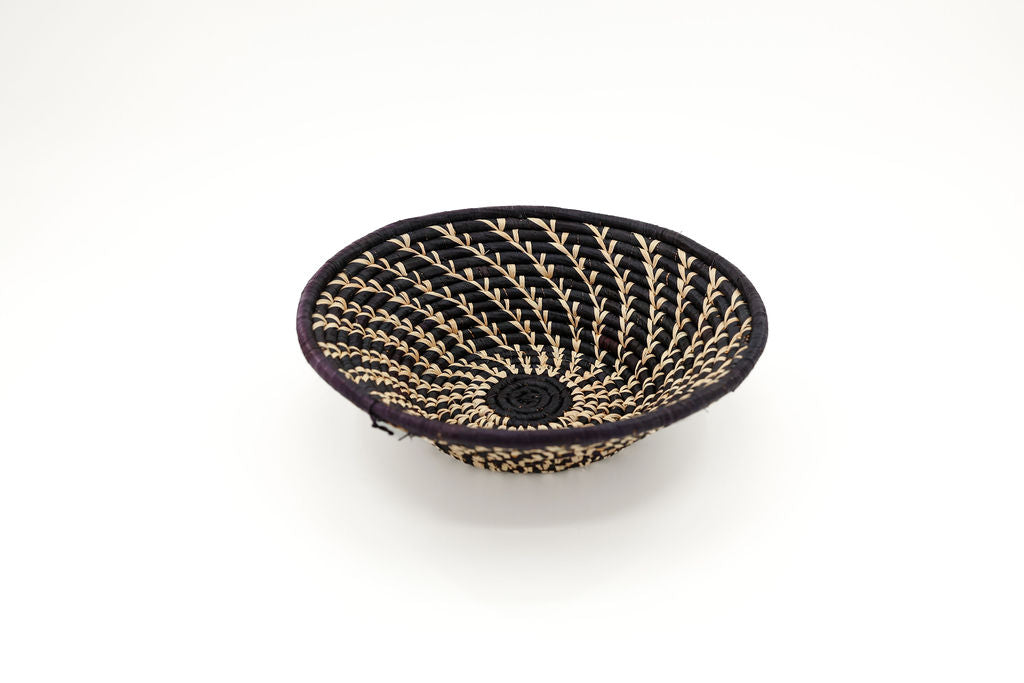 Handmade fair trade all-black raffia wall basket, eco-friendly African decor, perfect for minimalist and boho home styling.