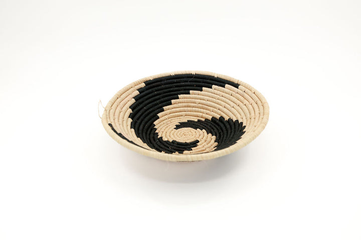 Handmade fair trade raffia bowl basket with unique design, natural-colored African decor, perfect for wall hanging and eco-friendly home accents.