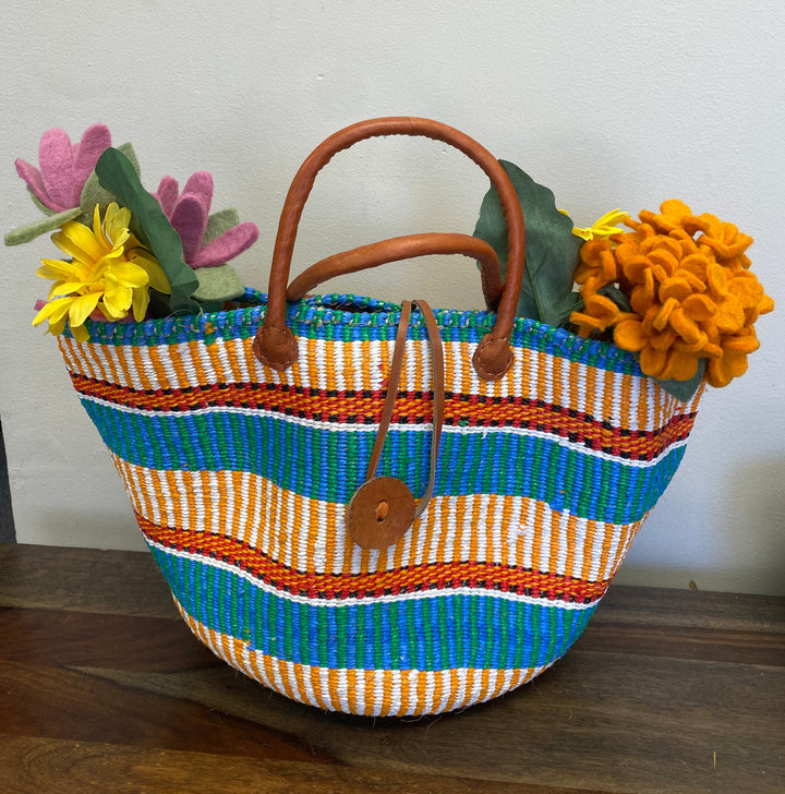 Fair Trade sisal and recycled plastic tote bag with short leather handles and button front, handmade in Kenya.