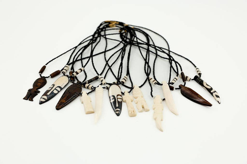 Sustainable upcycled bone necklace, hand-batiked pendant with glass beads, that is made in Kenya, Africa.