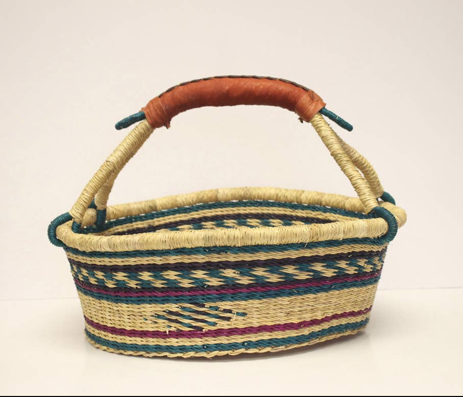 Artisan-crafted fair trade basket with leather handle, perfect as a bread, picnic, or knitting basket.