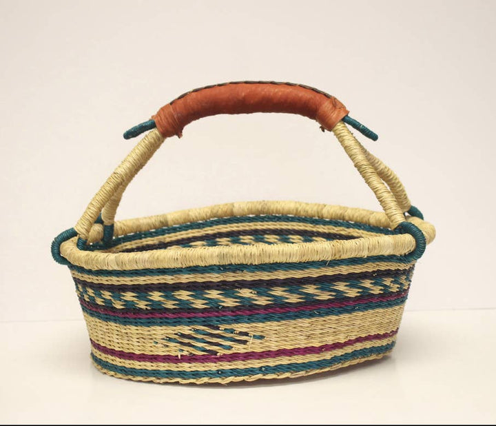 Artisan-crafted fair trade basket with leather handle, perfect as a bread, picnic, or knitting basket.