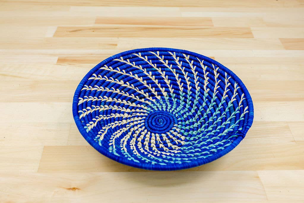 Eco-friendly handwoven raffia wall basket that's fair trade decor made from sustainable natural fiber for conscious home styling.