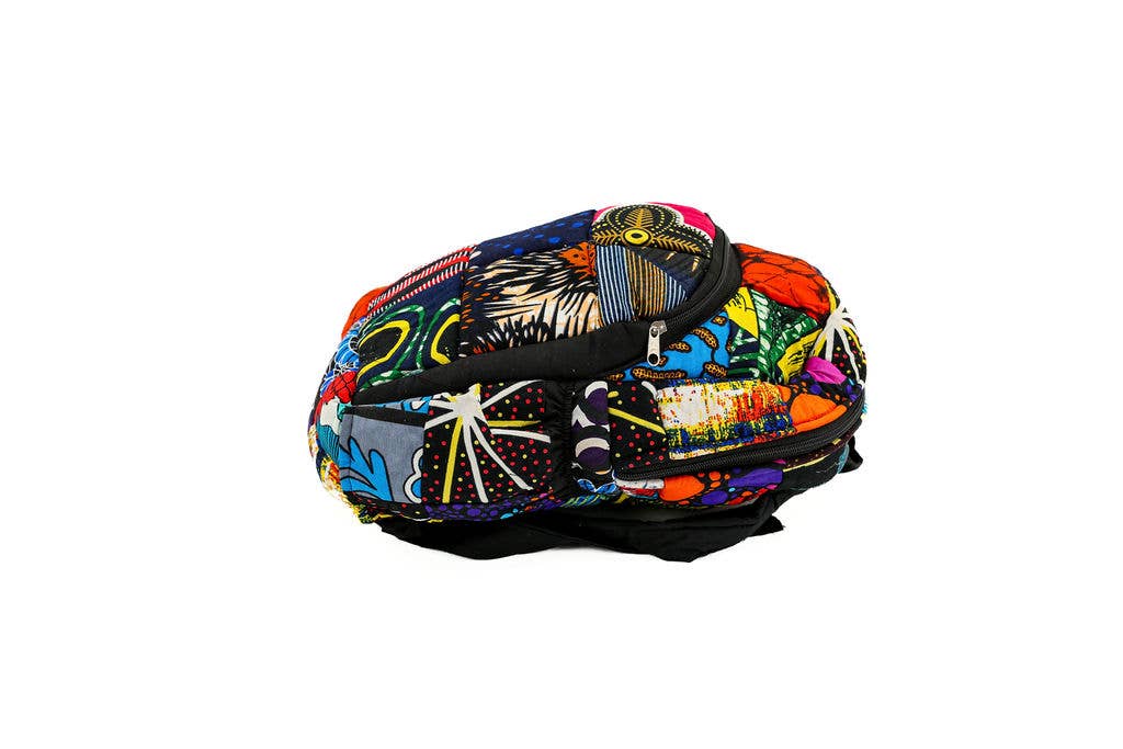 Up-cycled fabric backpack from Kenya with artistic patchwork design, multiple pockets, and eco-friendly materials for zero-waste lifestyle enthusiasts.