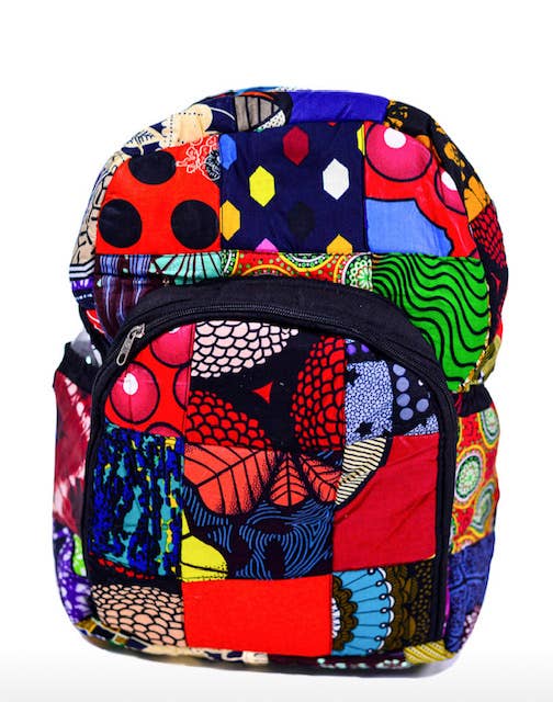 Eco-friendly patchwork backpack handmade in Kenya from up-cycled fabric, featuring vibrant colors, multiple pockets, and a secure zipper, perfect for sustainable fashion lovers.