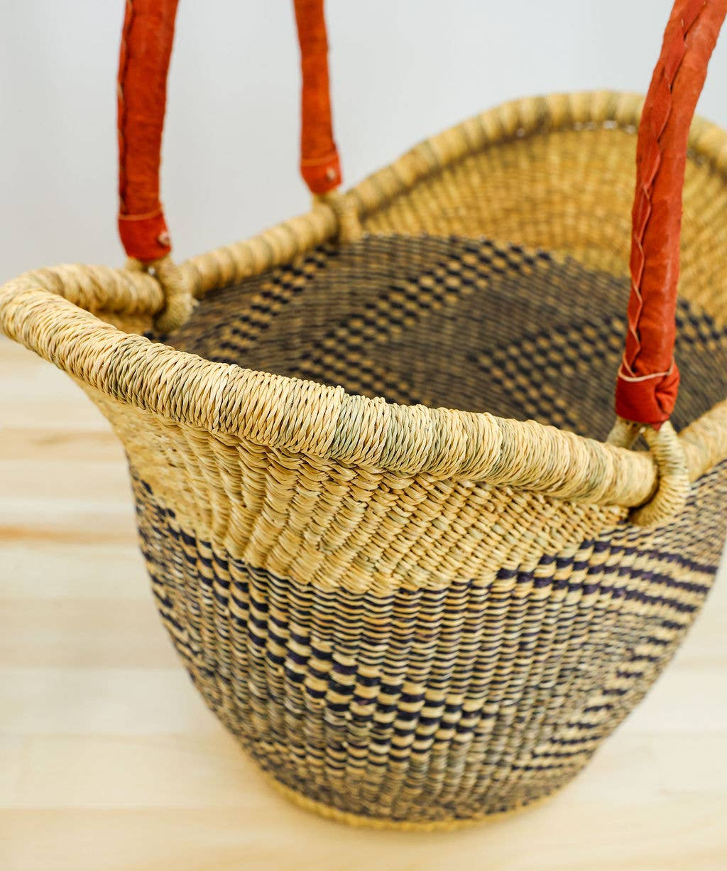 Blue and natural, artisan-crafted Ghanaian shopper basket.

