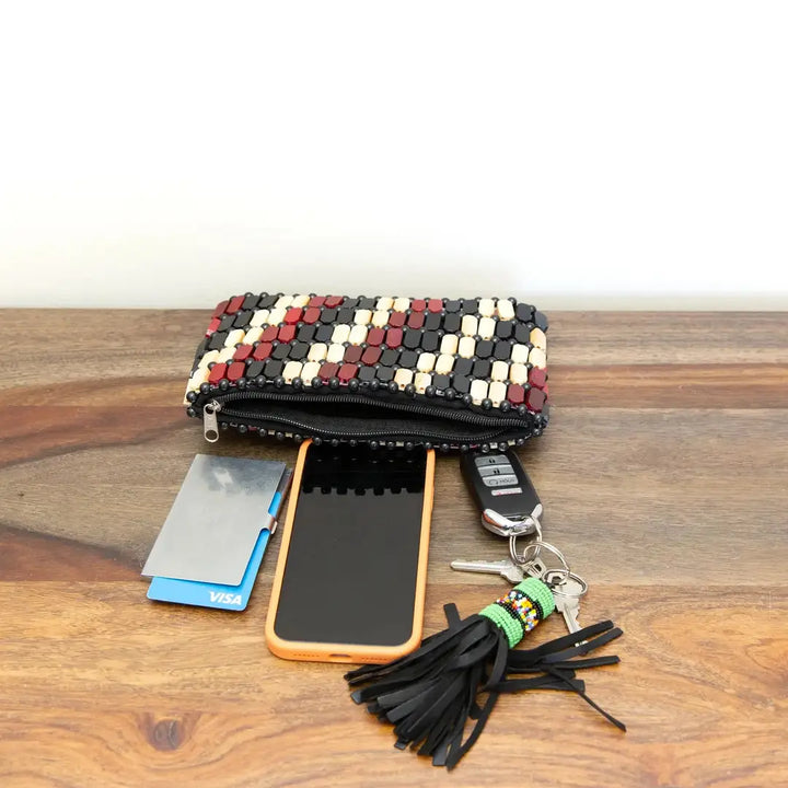 Everything fits in our neutral colored wooden clutch! Perfect for everyday essentials. 