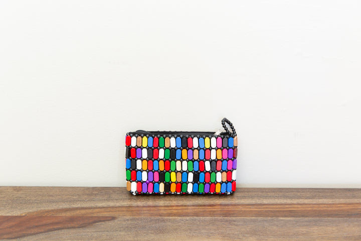 Colorful clutch bag made out of wood sourced from Kenya