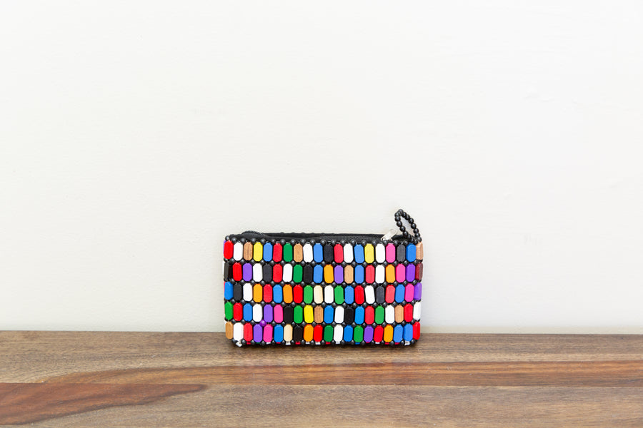 Colorful clutch bag made out of wood sourced from Kenya