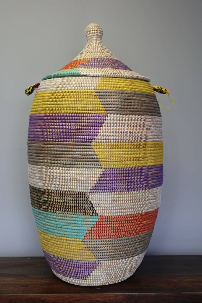 Artisan-made lidded basket with colorful design, sustainable and perfect for shelf storage or centerpieces.