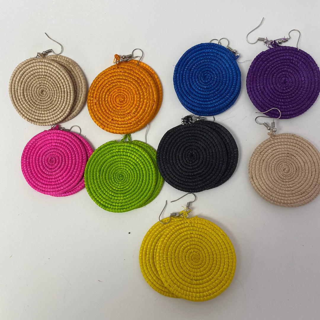 Assorted fair trade raffia earrings in bright woven colors.