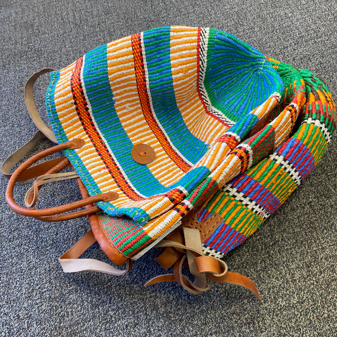 Kenyan handwoven totes with sustainable materials and leather trim, available in two handle styles.