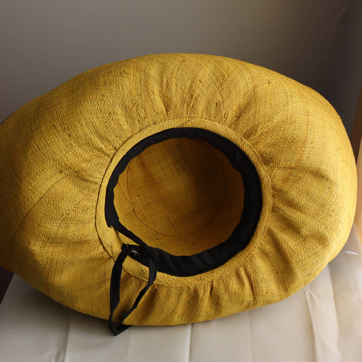 Fair trade raffia hat made in Madagascar, wide-brim style.