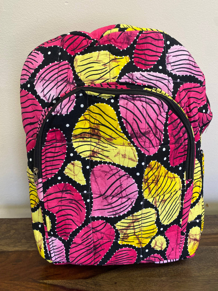 Stylish and sustainable backpack with colorful patchwork design, handmade in Kenya using recycled textile remnants.