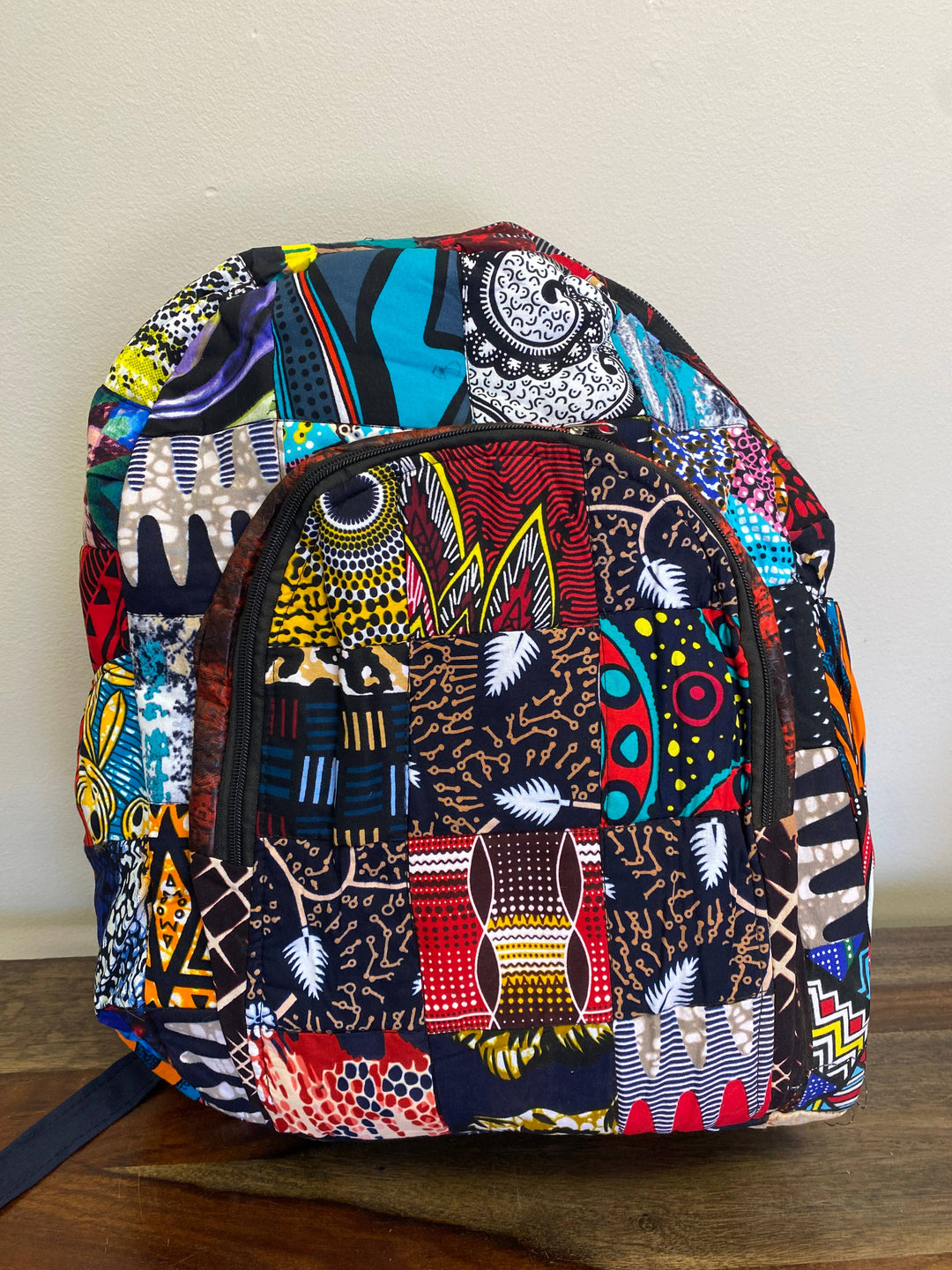 Fair trade patchwork backpack handcrafted in Kenya with eco-friendly up-cycled fabric, perfect for conscious consumers and everyday use.