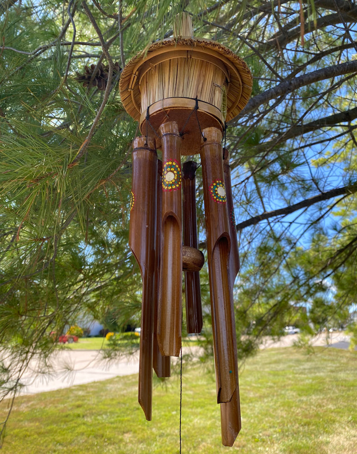 Eco-friendly bamboo wind chime with artistic dot motif, handmade by artisans