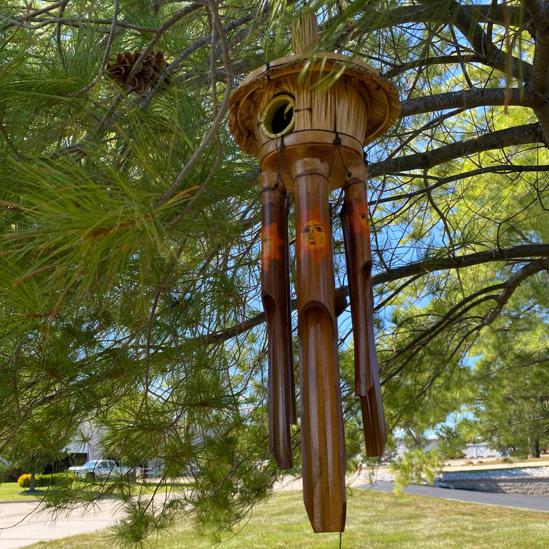 Eco-friendly bamboo wind chime with vibrant sun motif, handmade in Indonesia.