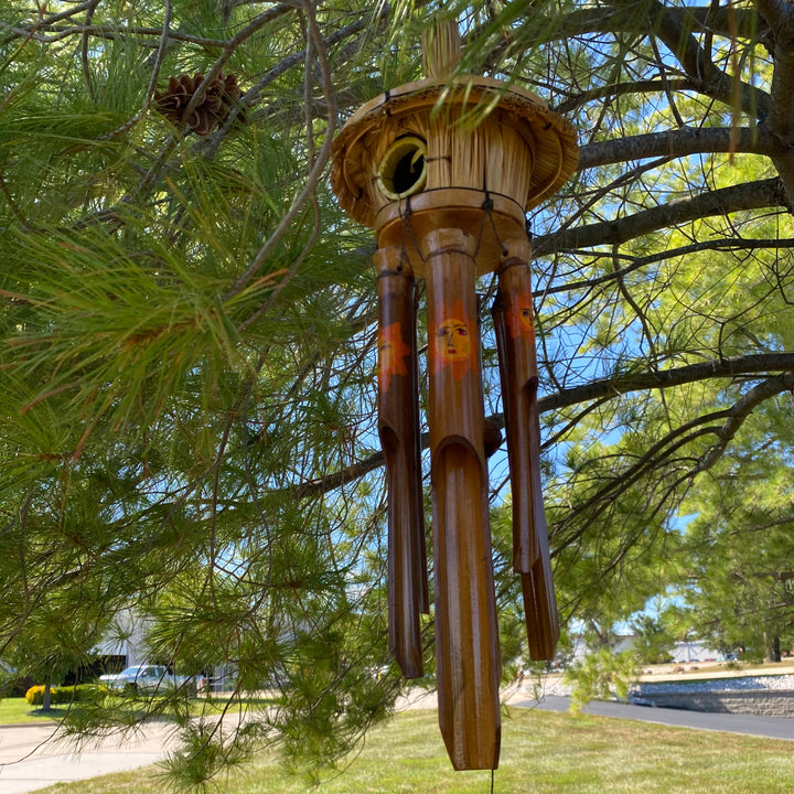 Eco-friendly bamboo wind chime with vibrant sun motif, handmade in Indonesia.