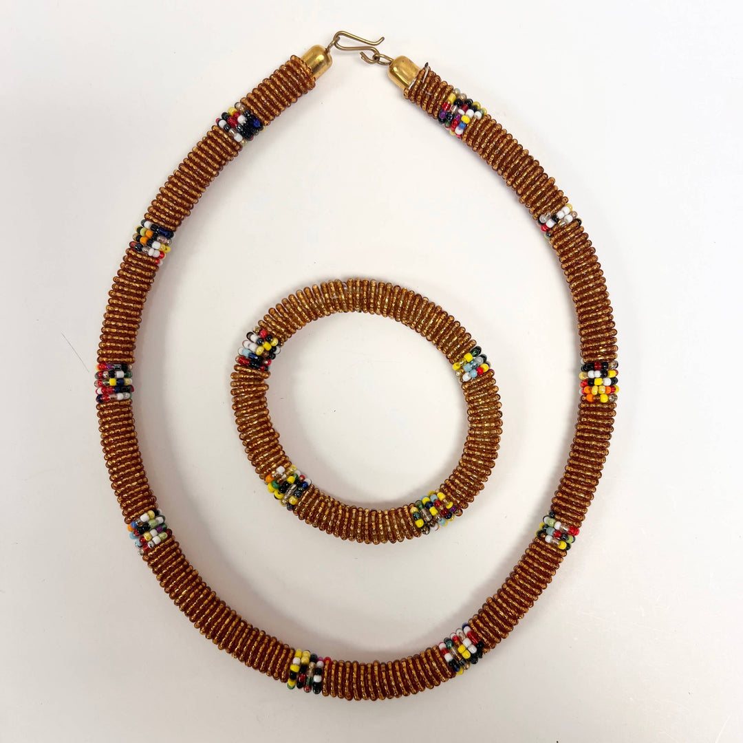 Colorful fair trade jewelry set from Kenya shown against neutral background.