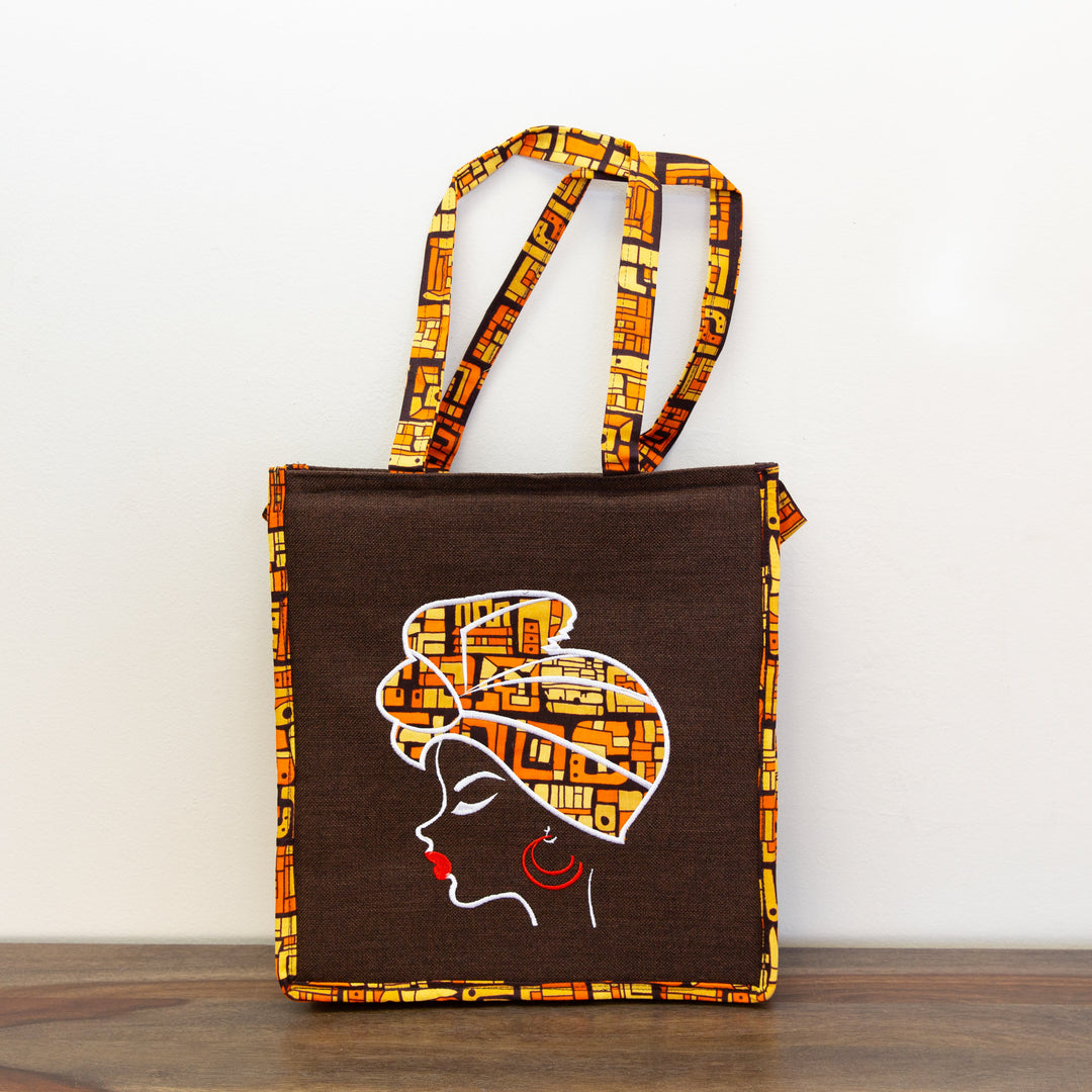 Fair trade padded laptop tote bag with vibrant African wax print, handmade in Kenya.