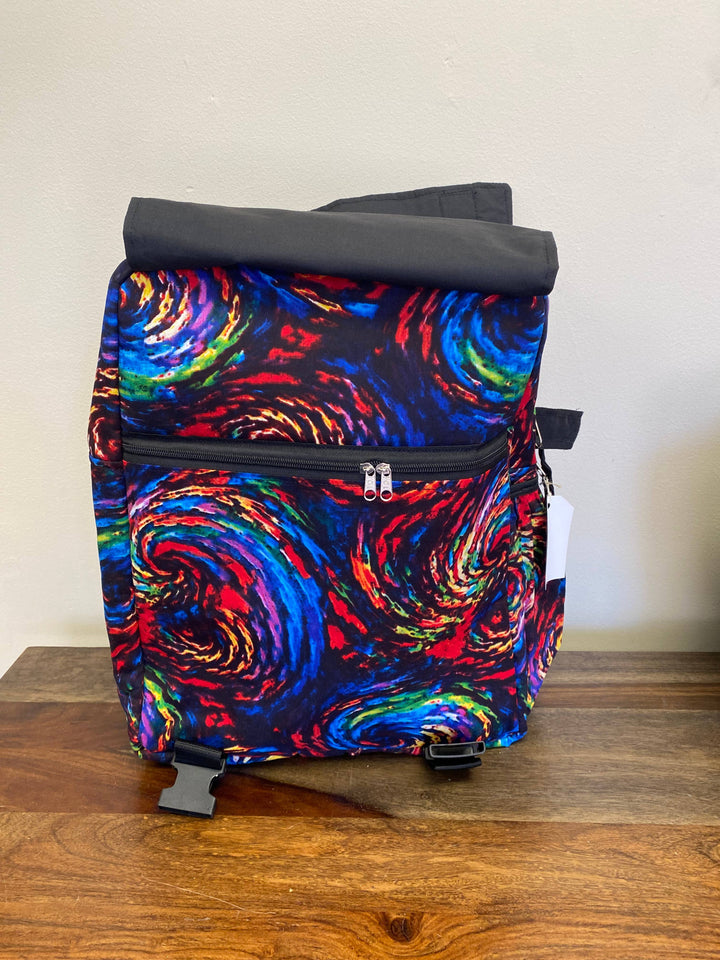 Eco-conscious fair trade backpack with artistic patchwork design, made from recycled materials for sustainable fashion lovers.