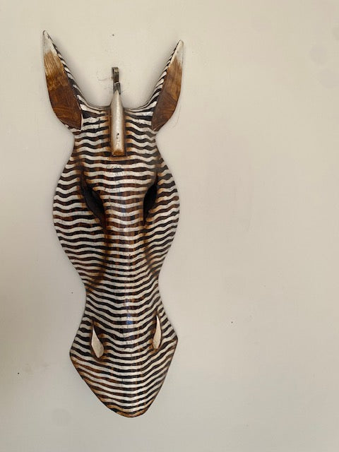 Hand-carved zebra mask made from sustainable bamboo.