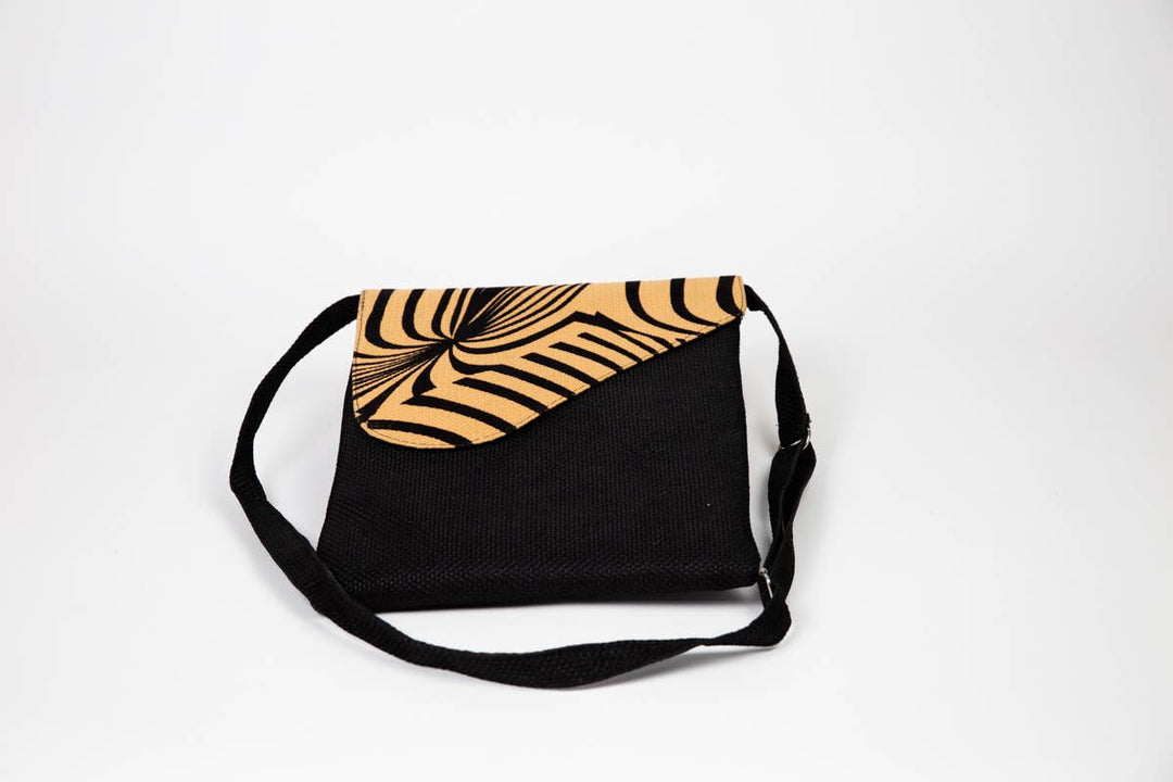 Fair trade African print crossbody bag with safari animal pattern.