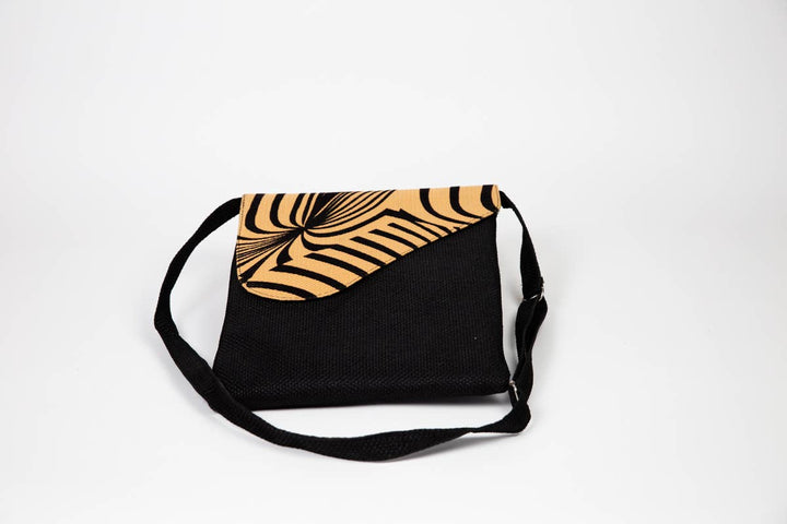 Fair trade African print crossbody bag with safari animal pattern.