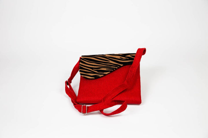 Detail shot of crossbody bag strap and upholstery fabric texture.