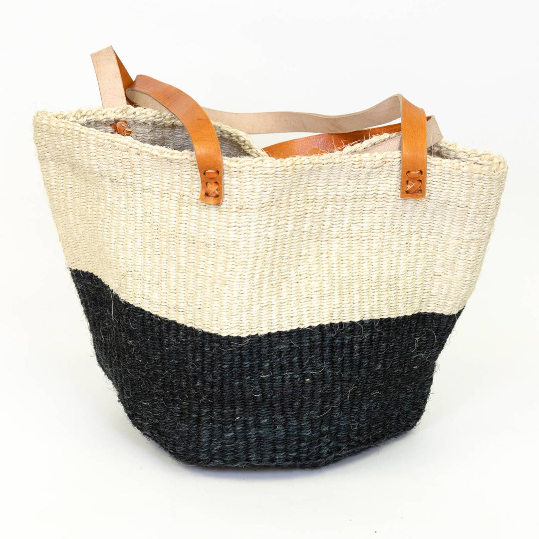 Fair trade sisal tote in bold black and white stripes, durable and handwoven with leather handles.