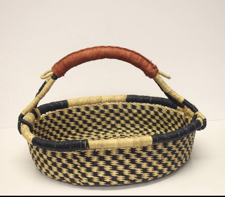 Eco-friendly fair trade bread basket, handmade with unique color patterns and durable craftsmanship.