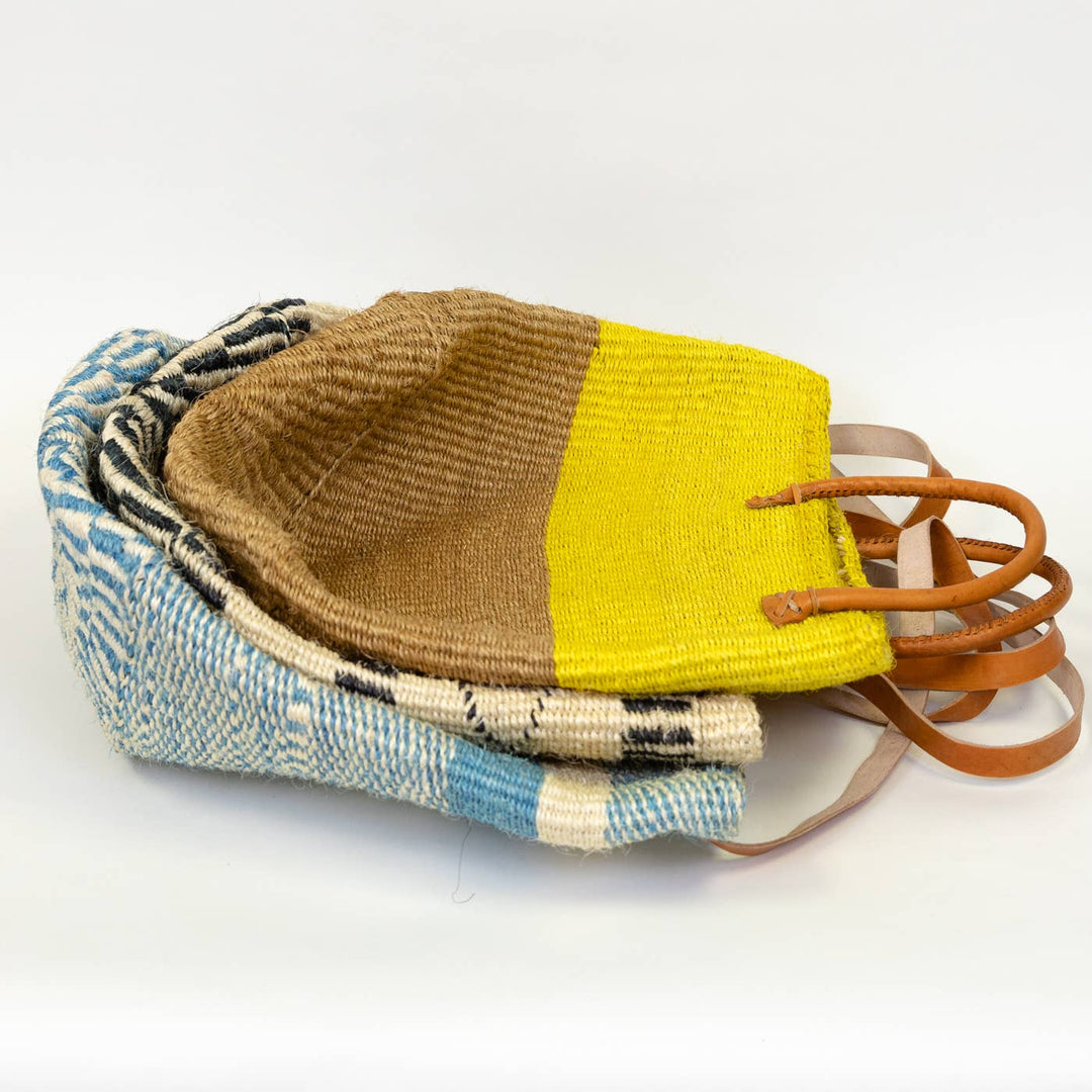 Fair trade woven market basket in natural sisal fiber.