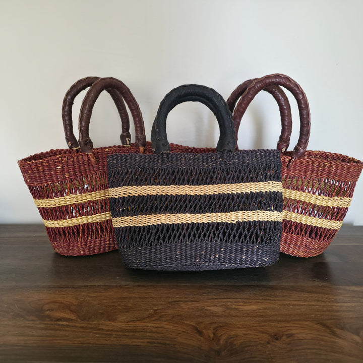 Ghanaian fair trade woven handbag with eco-friendly materials, perfect for everyday or beach use.
