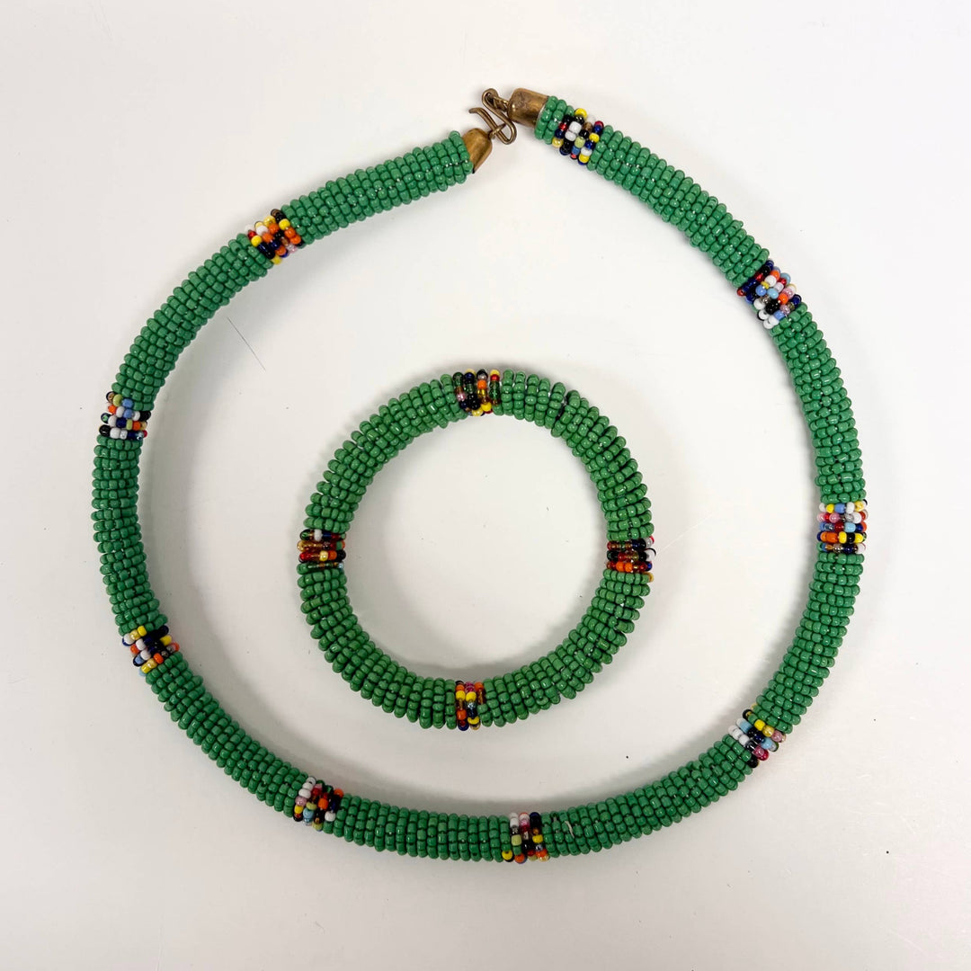 Handmade necklace and bracelet set from Kenya in green beaded patterns.
