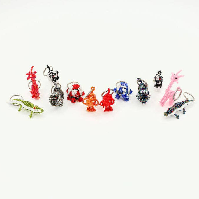 Hand-beaded fair trade safari animal keychains in assorted colors and animal shapes.