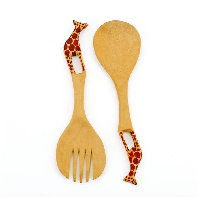 Hand-carved African mahogany serving spoons with painted safari animal designs.